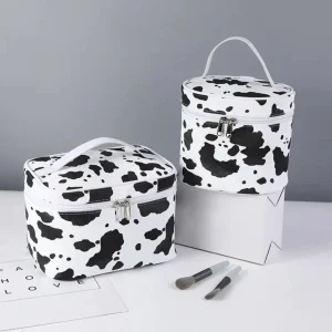 Stylish Waterproof Cow Pattern Portable Cosmetic Bag for Organizing Skin Care Products and Travel Essentials.